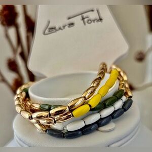 Laura Ford Goldtone 5 Row Rice bead yellow,green, blues & white,chunky stretch